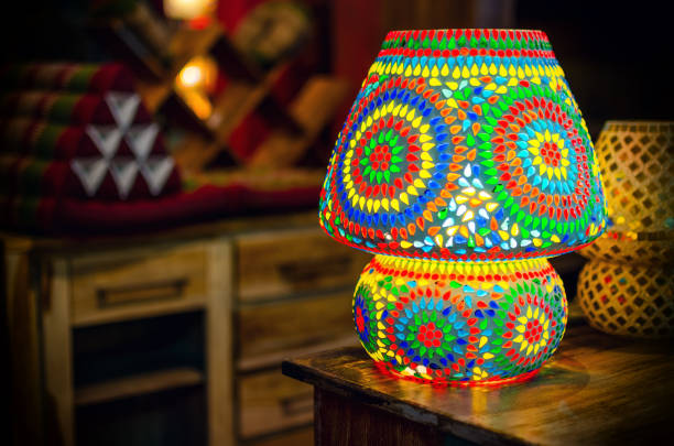 Traditional turkish glass table lamp on a wooden desk