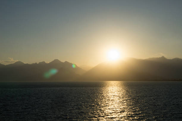istock View over harbour to mountains and sunset. 951315794
