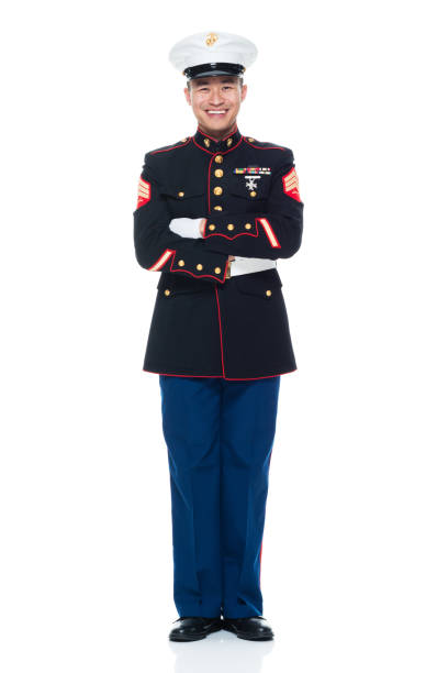 istock US Marine in uniform with arms crossed 951321416