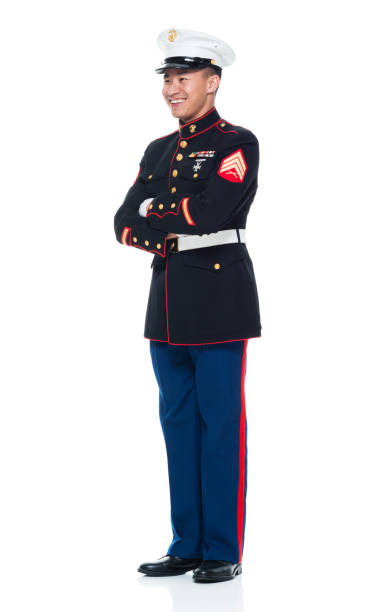 istock US Marine in uniform with arms crossed 951321428