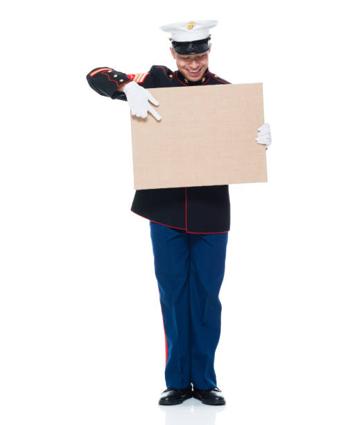 istock US Marine in uniform holding placard 951321462
