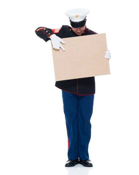 istock US Marine in uniform holding placard 951321566