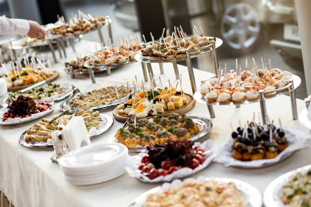 istock holiday buffet table served by different canape, sandwiches, snacks ready for eating in restaurant 951321640