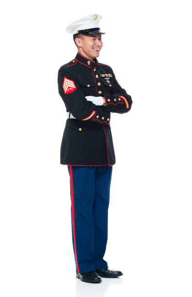 istock US Marine in uniform with arms crossed 951321754