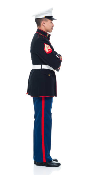 istock US Marine in uniform with arms crossed 951321782