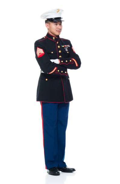 istock US Marine in uniform with arms crossed 951322014