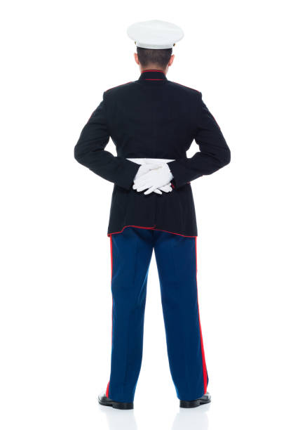istock US Marine in uniform with arms behind 951322290