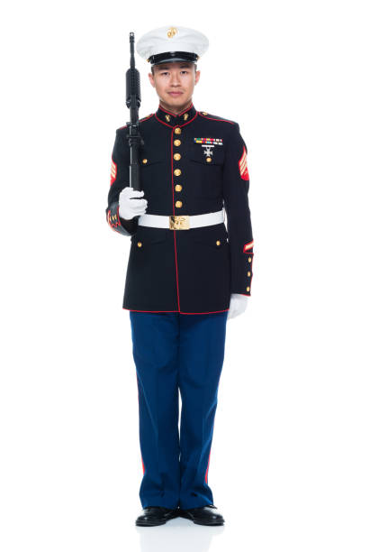istock US Marine in uniform holding rifle 951322626