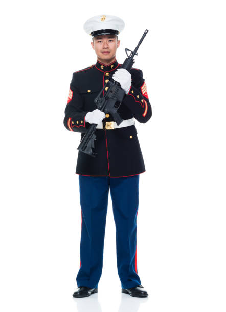 istock US Marine in uniform holding rifle 951322656