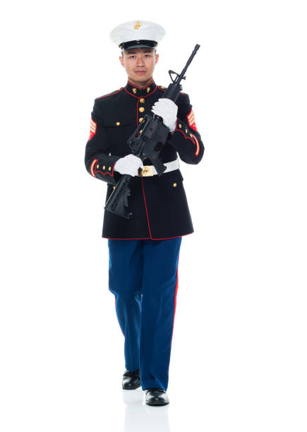 istock US Marine in uniform holding rifle 951322798