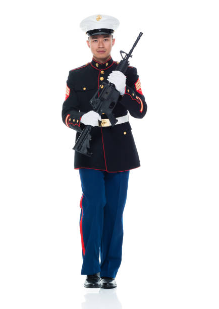istock US Marine in uniform holding rifle 951322820