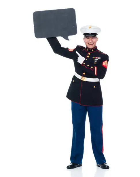 Photo of US Marine in uniform holding speech bubble