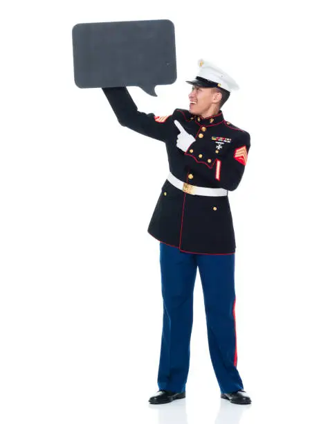 Photo of US Marine in uniform holding speech bubble