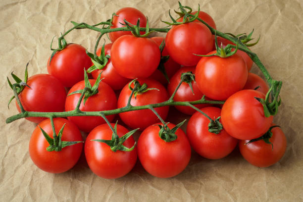 istock Fresh cherry tomatoes on crumpled paper background 951323098