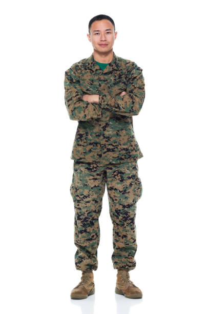 istock US Marine in uniform with arms crossed 951325534