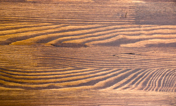 legno marrone grana trama, vista dall'alto dello sfondo della parete in legno del tavolo in legno - orange wall textured paint foto e immagini stock