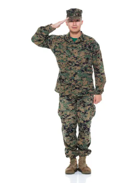 Photo of US Marine in uniform saluting
