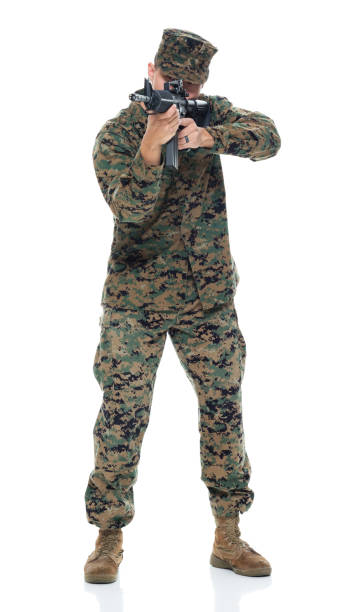 istock US Marine in uniform aiming rifle 951325684