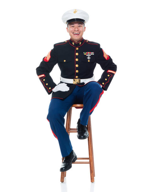 istock US Marine in uniform sitting on stool 951326240