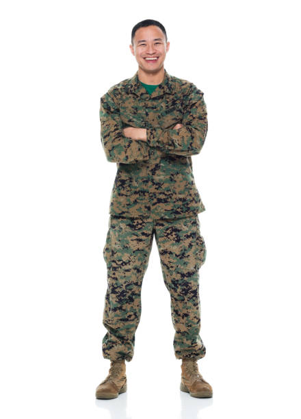 istock US Marine in uniform with arms crossed 951326244