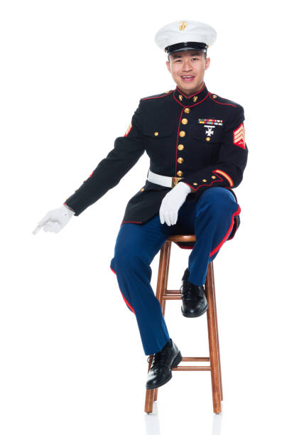 istock US Marine in uniform sitting on stool 951326258