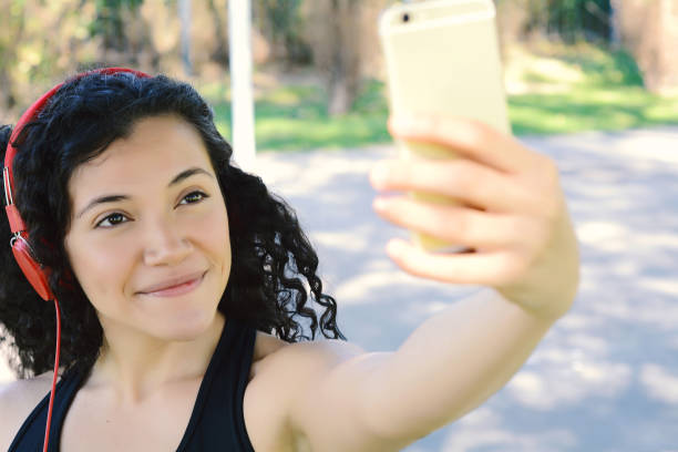 istock Young woman taking selfie with her smartphone. 951326428