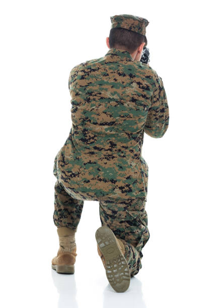 istock US Marine in uniform aiming rifle 951326442
