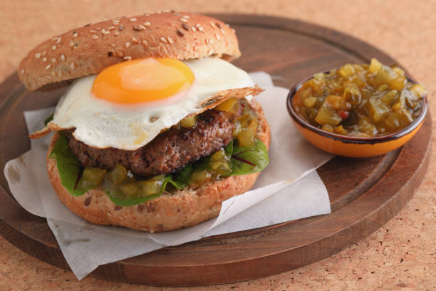 istock Hamburger with fried egg and gherkin salad 951331942