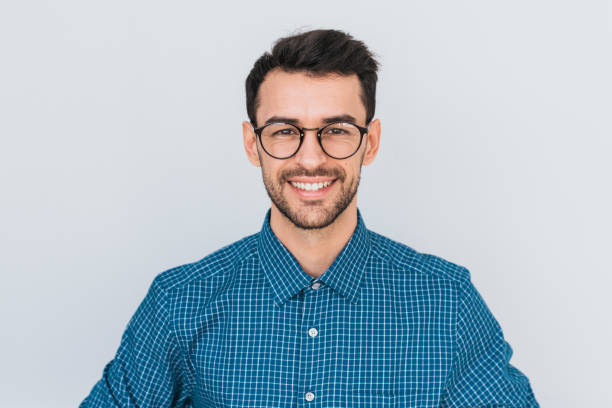 closeup portrait of handsome smart-looking smiling with toothy smile male posing for social advertisement, isolated on white background with copy space for your promotional information or content. - casual shirt imagens e fotografias de stock