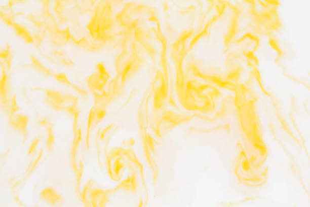 istock Yellow white abstract background, yellow pattern of paints on liquid, blank for designer, paint divorces in milk, bright texture on white background, minimalism, creative blank for wallpaper, art 951335410