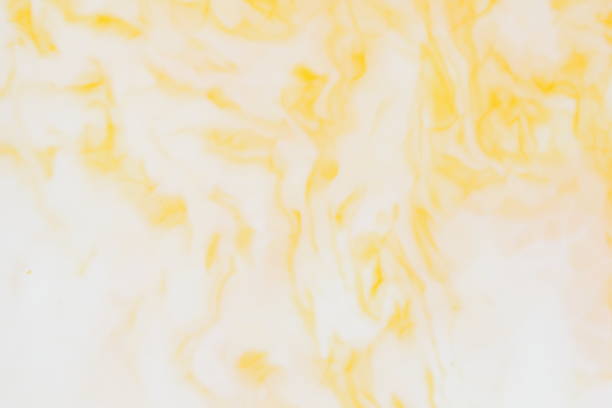 istock Yellow white abstract background, yellow pattern of paints on liquid, blank for designer, paint divorces in milk, bright texture on white background, minimalism, creative blank for wallpaper, art 951335426