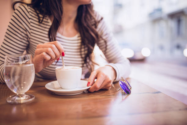 istock Young woman enjoy coffee at restaurant, using mobile smart phone 951344642