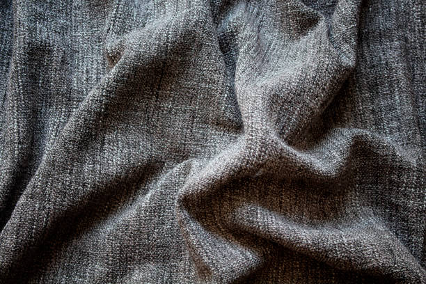 istock Close up view of crumpled, grey wool fabric background. 951348958