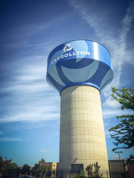istock Water tower in Carrollton, Texas against cloud blue sky 951359838