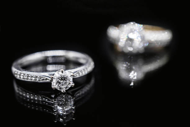 istock Close up Jewelry diamond ring on black background with reflection 951367198