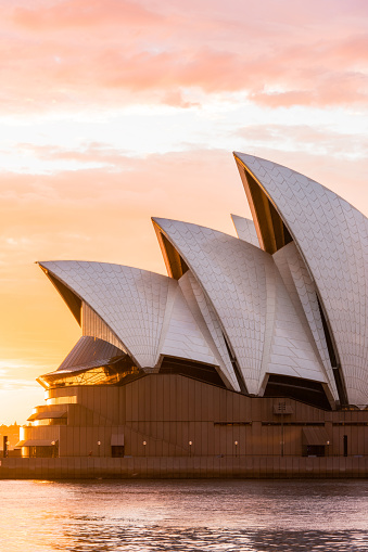 Sydney, Australia - March 25, 2018: Sydney Opera House close-up view with sunrise sky on the background.
