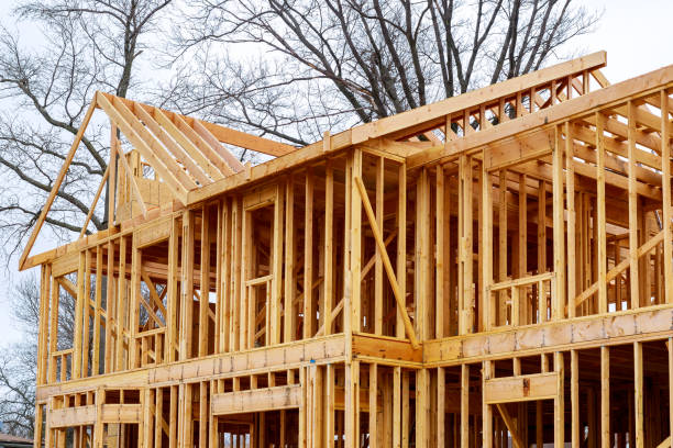 istock wood framework of new residential home under construction. 951381644