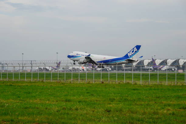 Nippon Cargo Airlines Plane landing to runways at suvarnabhumi international airport in Bangkok ,Thailand. Bangkok, Thailand - July 30, 2017: Nippon Cargo Airlines Plane landing to runways at suvarnabhumi international airport in Bangkok ,Thailand. This airport is one of the most populated airports in the world. nippon cargo airlines photos stock pictures, royalty-free photos & images