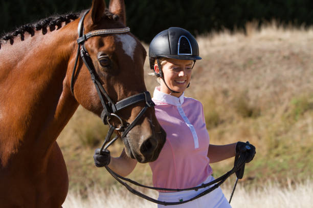 istock Horse Rider Walking Alongside Her Horse 951382788