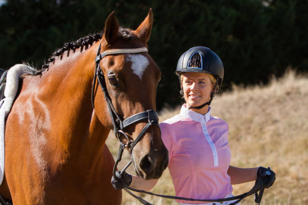 istock Horse Rider Walking Alongside Her Horse 951382790
