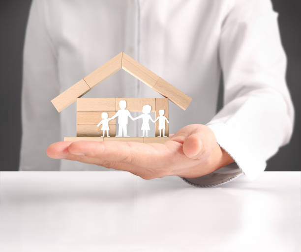 istock holding house representing home ownership 951392942