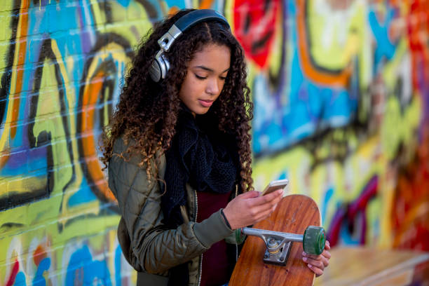 istock Girl Sitting With Skateboard 951395886
