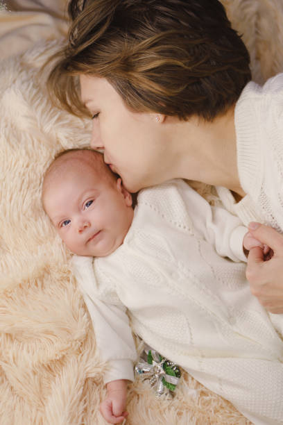 istock Mother and newborn daughter 951402636