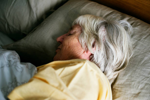 istock Senior woman is sleeping on the bed 951405552