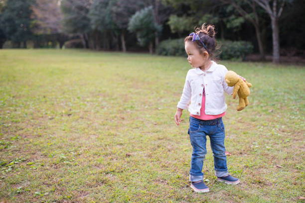 istock Teddy bear and little girl 951405702