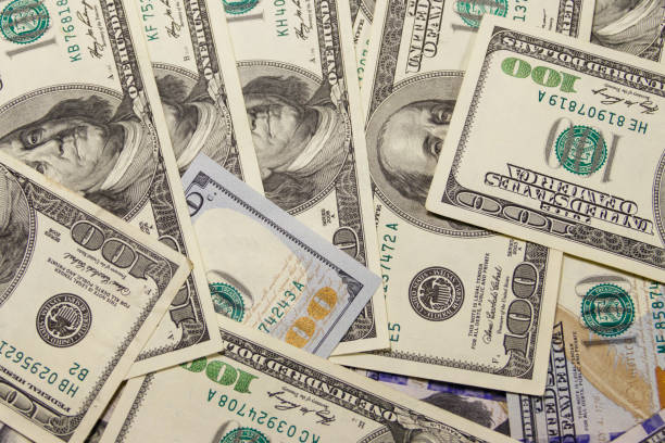 istock Background of one hundred dollar bills 951406078