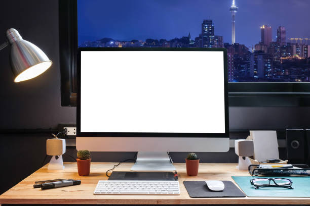 istock Graphic designer's workspace with a pen tablet, a computer and white backgroud for text with beautiful view of Cityscape in Macau from Window 951423118