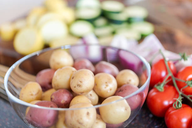 Slicing fresh organic vegetables for veggie kebabs.