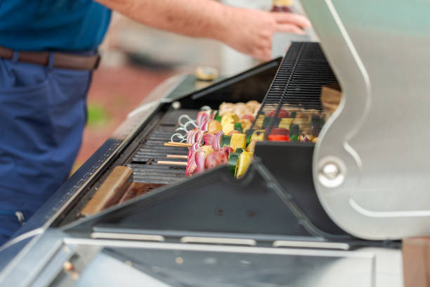 istock Grilling veggie skewers and chicken kebabs 951426228