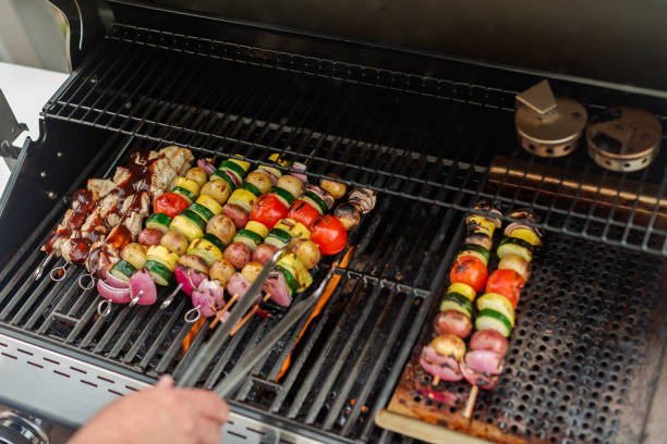 istock Grilling veggie skewers and chicken kebabs 951426254